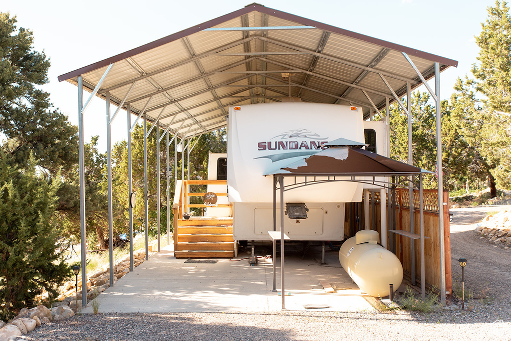 View of parking with a carport