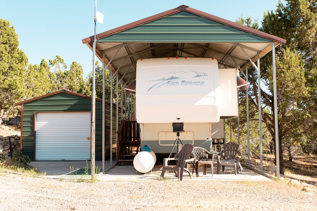 View of outbuilding featuring a carport