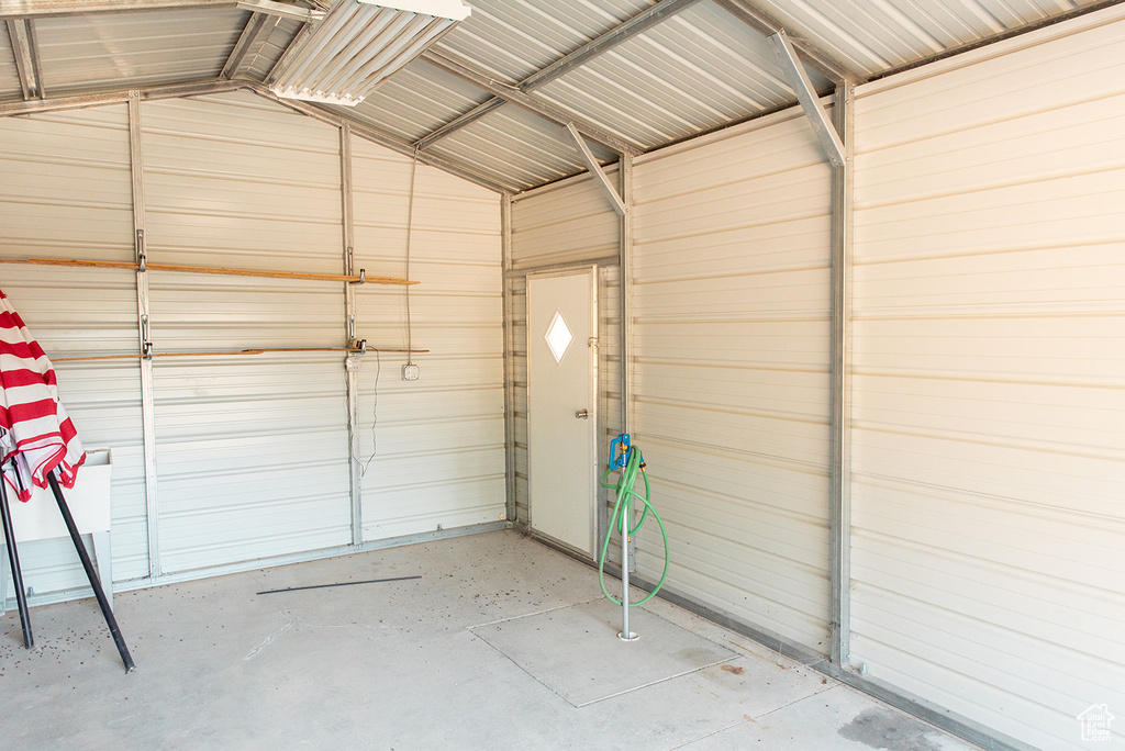 Garage featuring metal wall