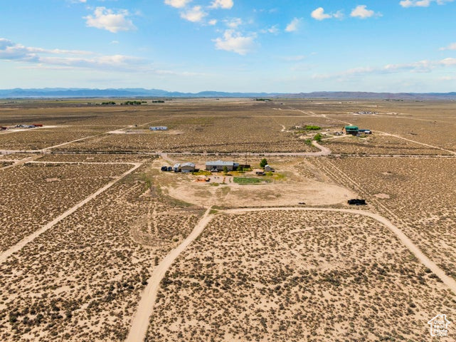 Overview of rural landscape featuring a mountainous background and a desert landscape