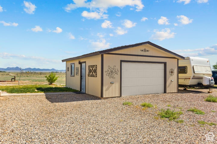 Detached garage featuring a mountain view