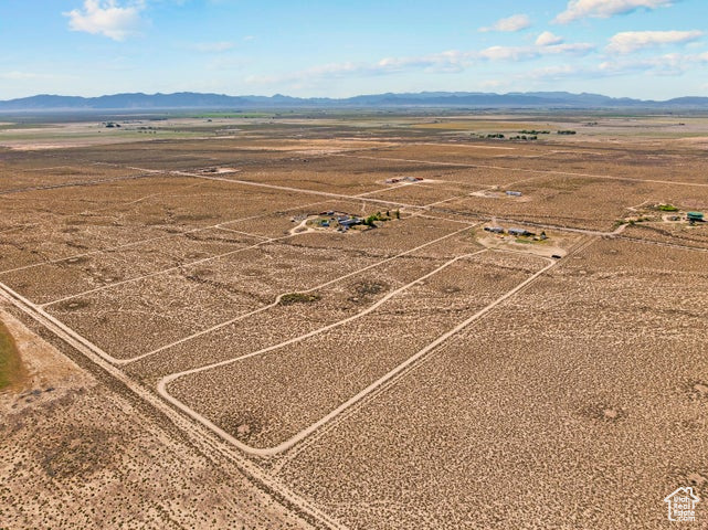 Aerial view of sparsely populated area featuring a mountainous background