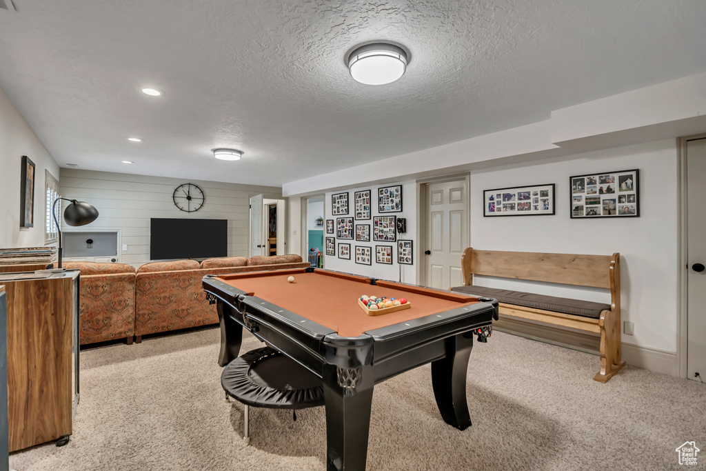 Recreation room featuring light colored carpet, a textured ceiling, recessed lighting, and billiards table