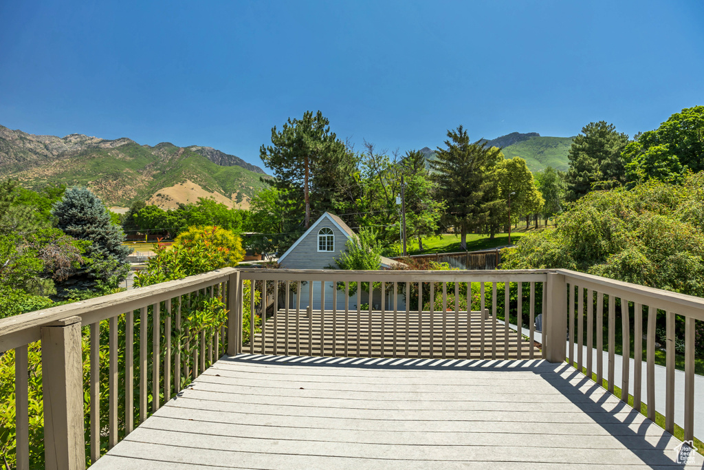Wooden deck featuring a mountain view
