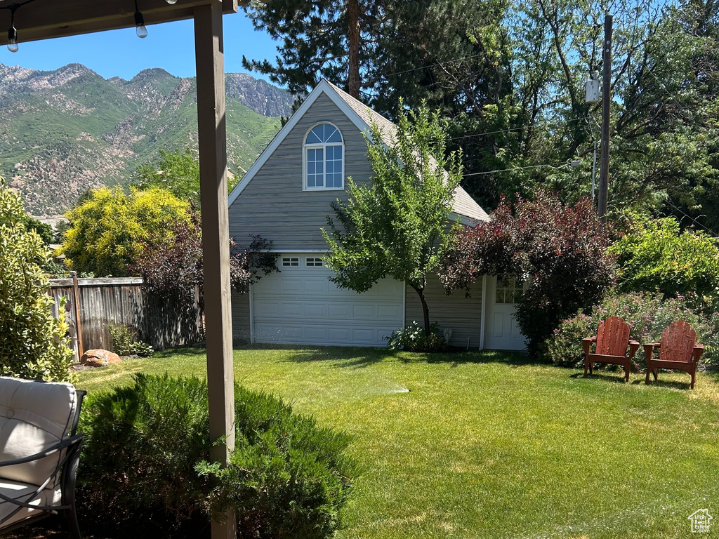 Wooden deck with a mountain view and a pergola