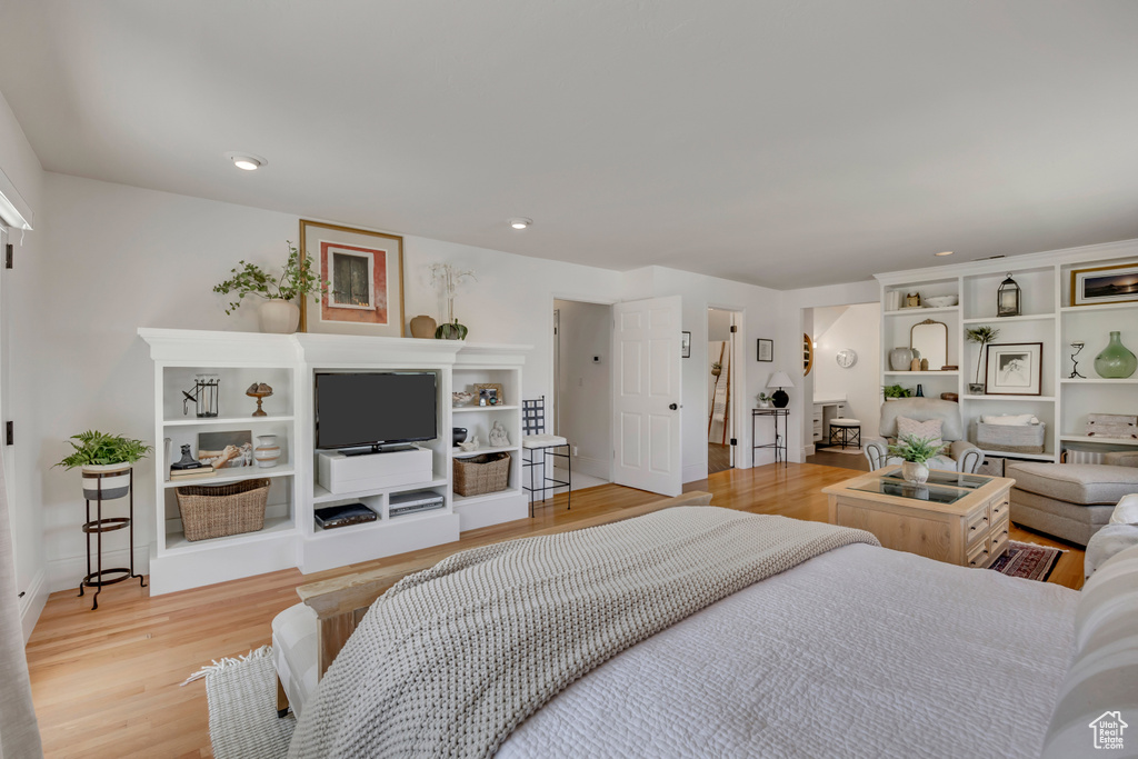Bedroom with light wood-style flooring and recessed lighting