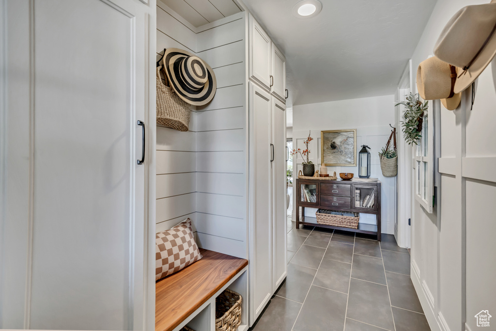 Mudroom featuring dark tile patterned floors and recessed lighting
