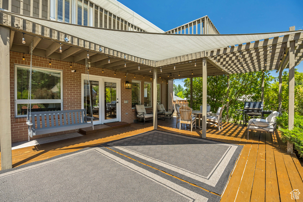 Wooden terrace featuring outdoor dining space