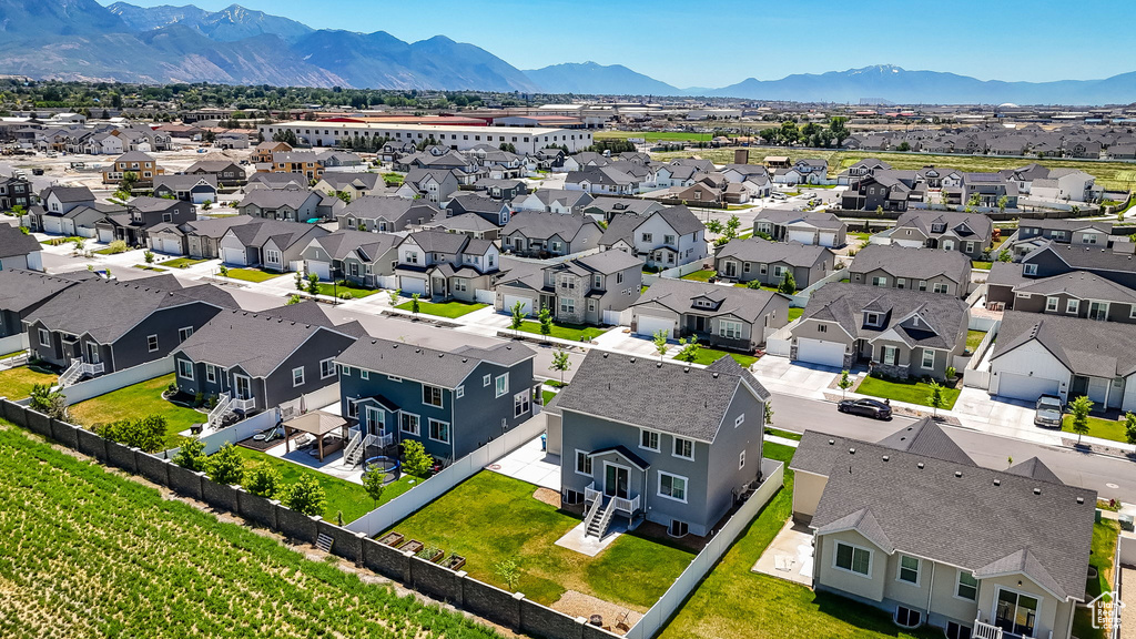 Aerial perspective of suburban area featuring a mountainous background