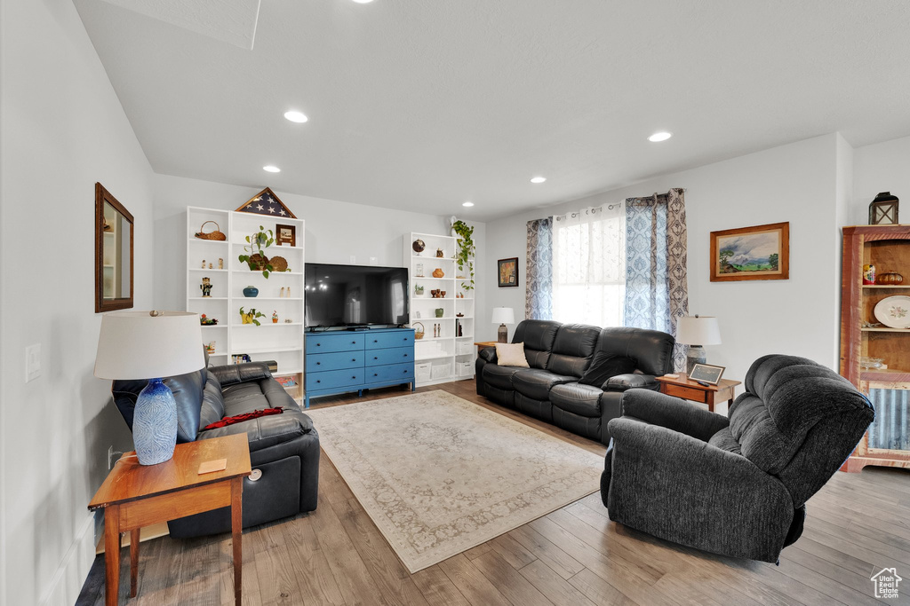 Living room featuring recessed lighting and wood finished floors