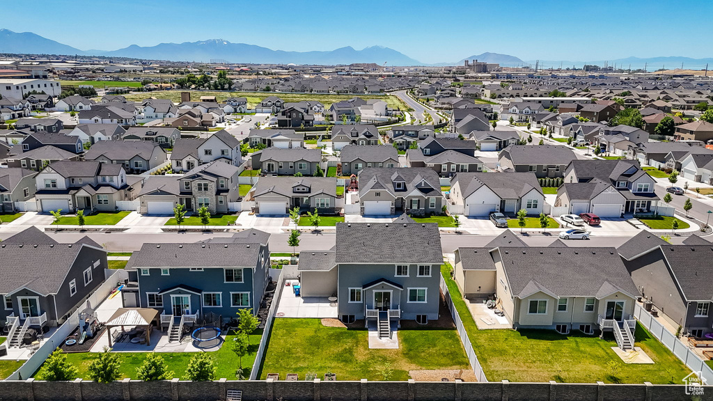 Aerial perspective of suburban area featuring a mountain backdrop