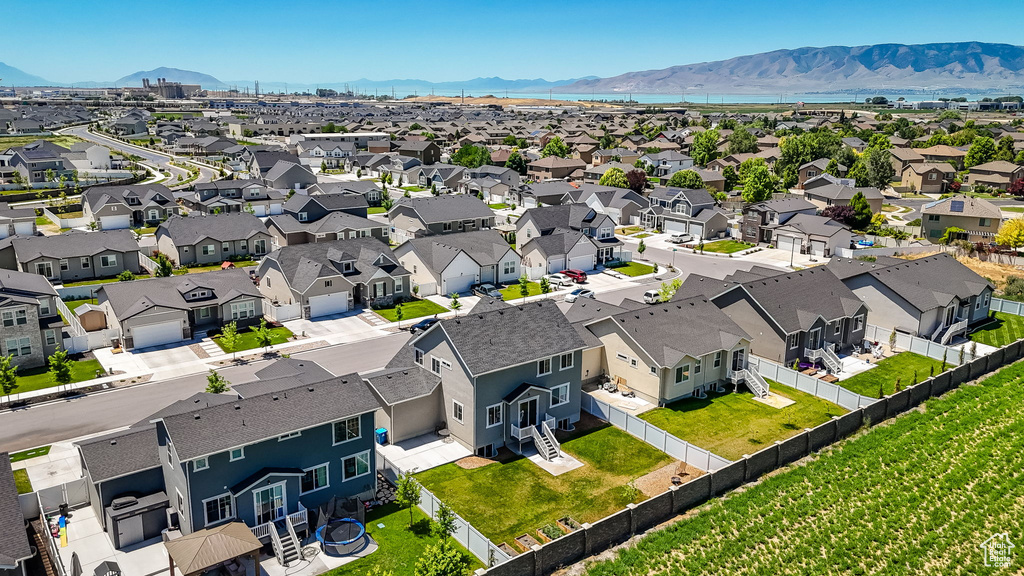 Aerial view of residential area featuring mountains