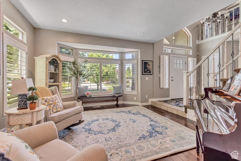 Living room featuring healthy amount of natural light, wood finished floors, and recessed lighting