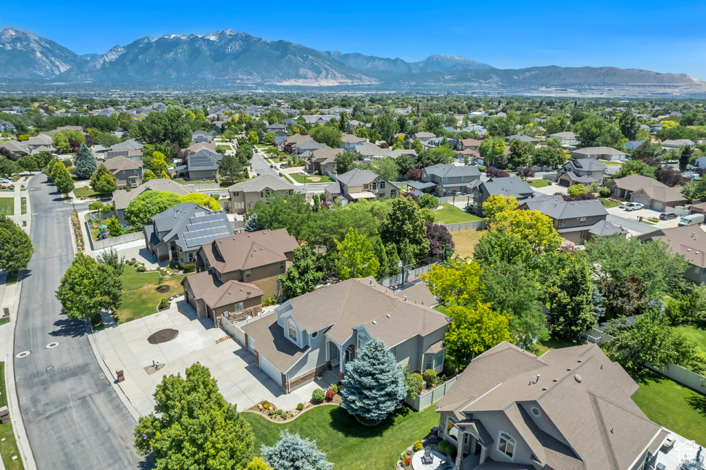 Aerial view of residential area featuring a mountainous background