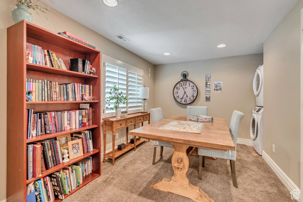 Home office with estacked washer and dryer, carpet flooring, and recessed lighting
