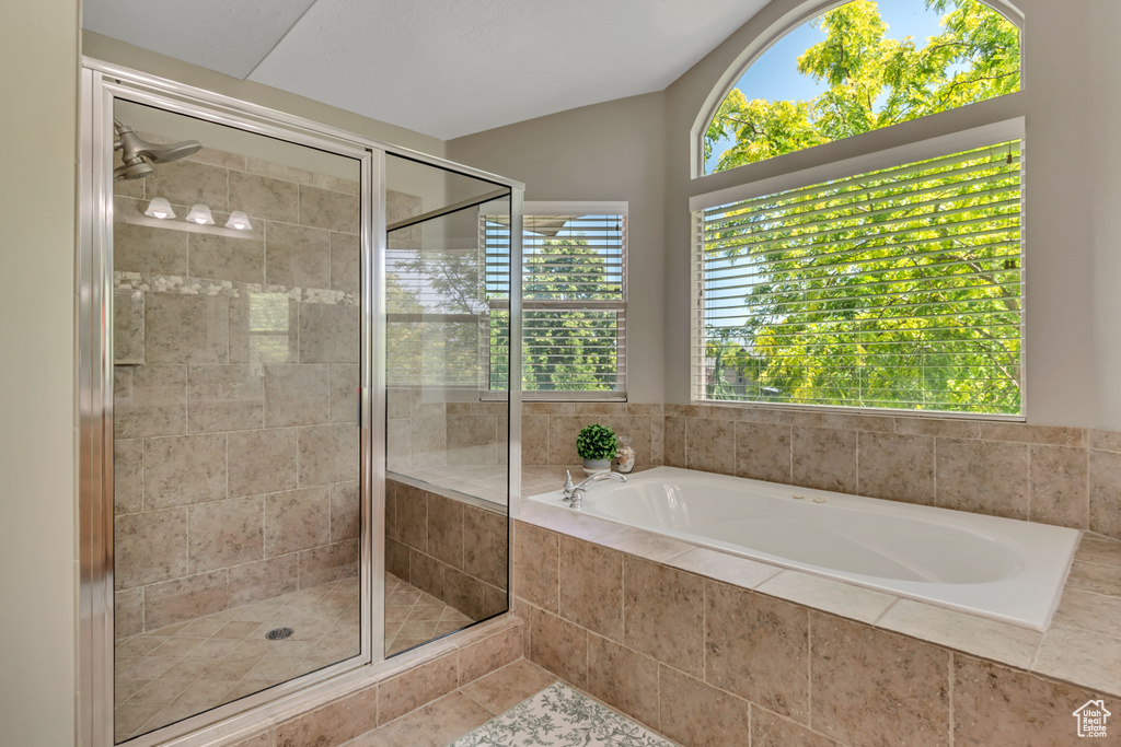 Bathroom with a garden tub and a stall shower