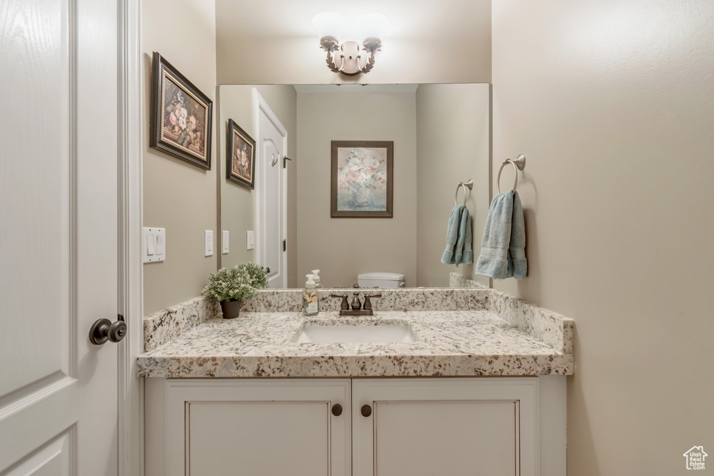 Bathroom with vanity and toilet