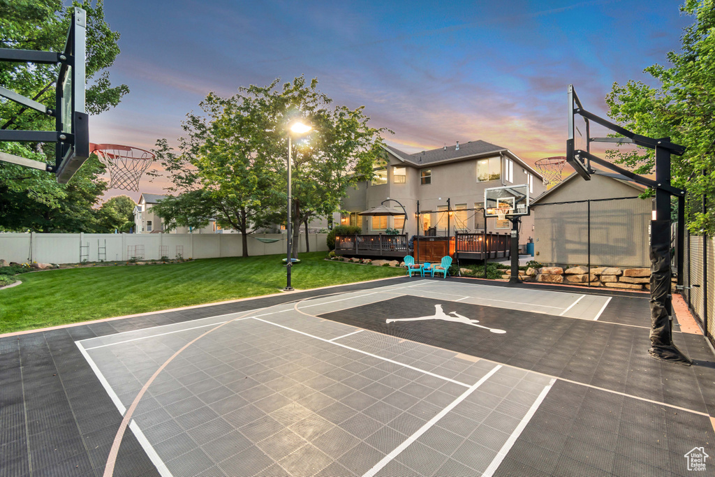 View of sport court featuring basketball hoop and a gazebo