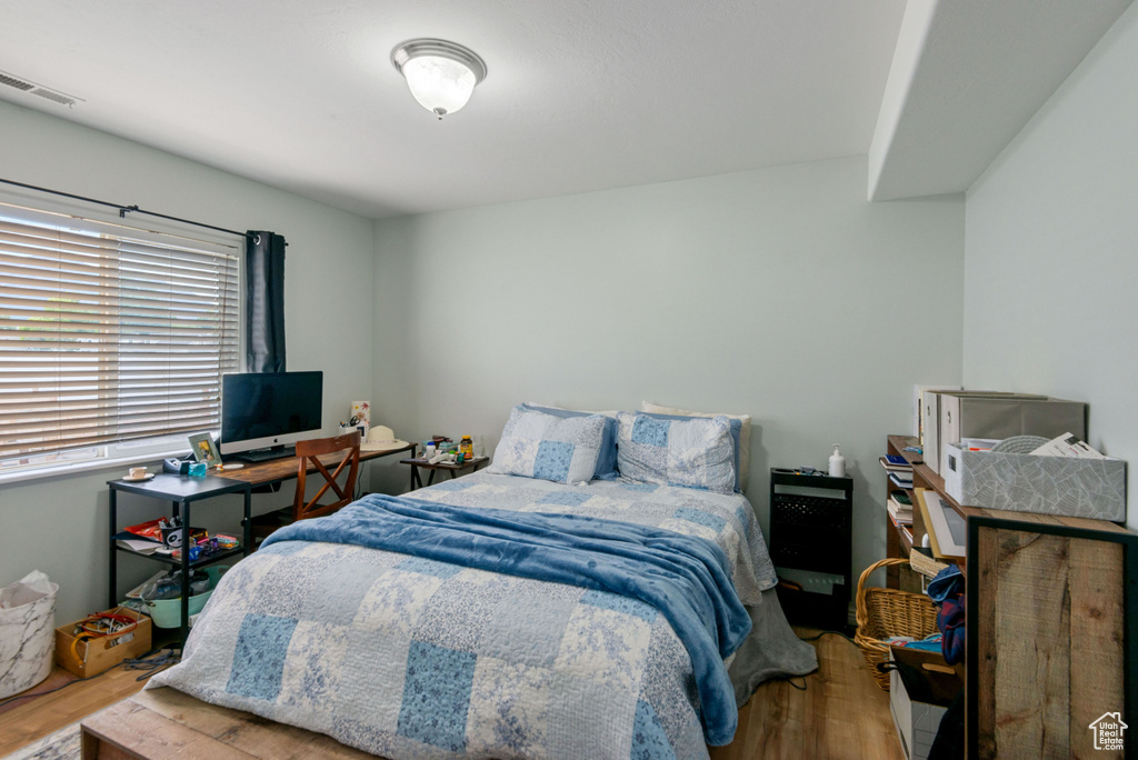 Bedroom with wood finished floors