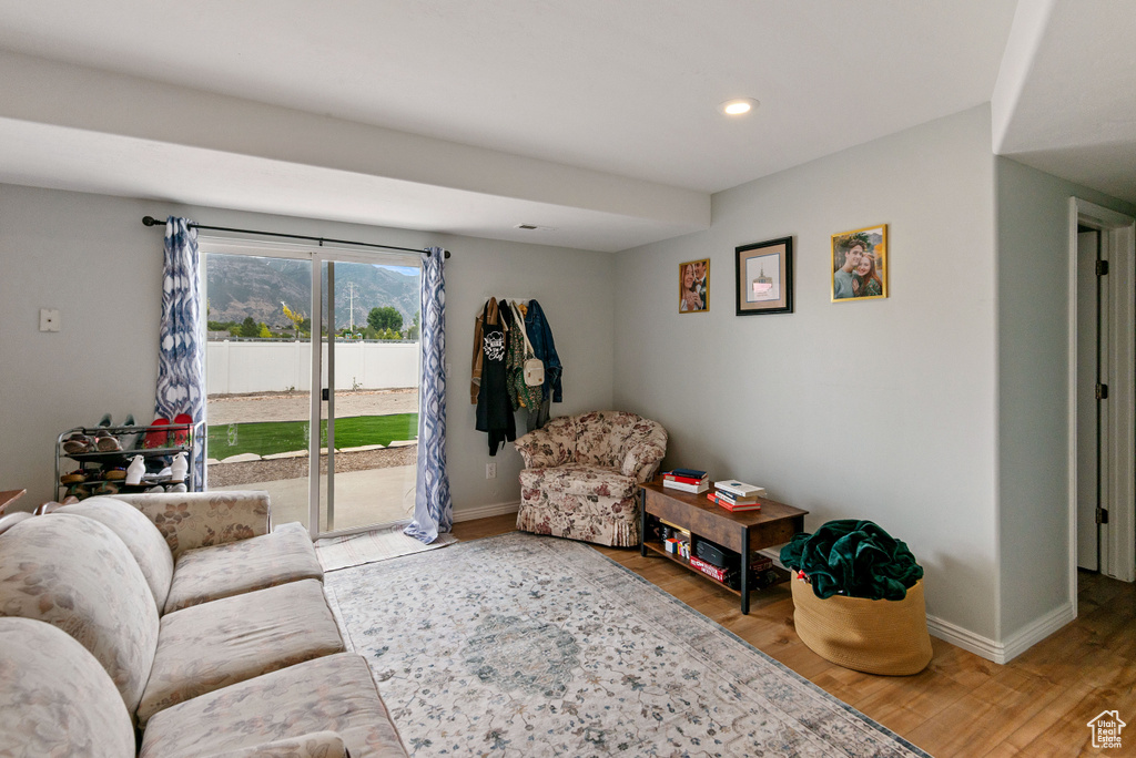 Living room with wood finished floors and recessed lighting
