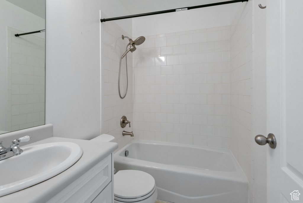 Bathroom with vanity and tub / shower combination