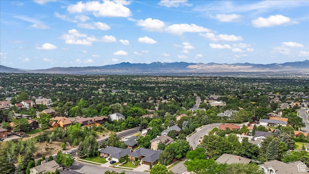 Aerial perspective of suburban area featuring a mountainous background