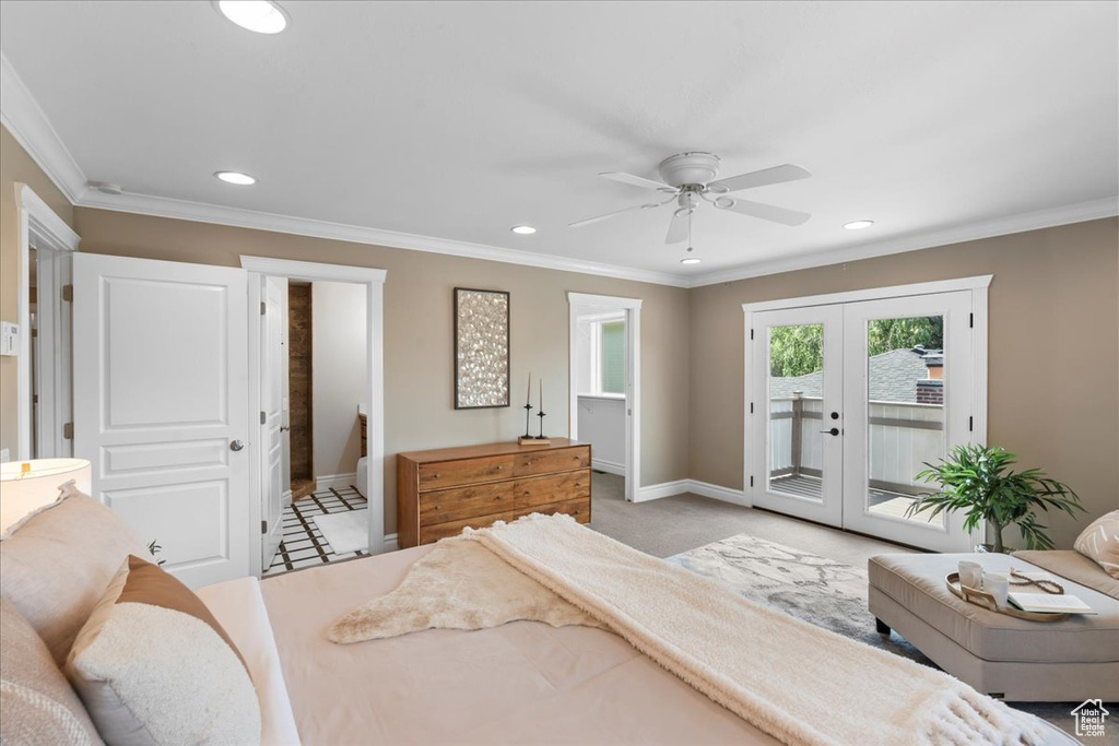 Bedroom with recessed lighting, access to exterior, french doors, ornamental molding, and ensuite bathroom