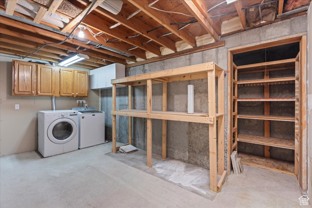 Unfinished basement with washing machine and dryer
