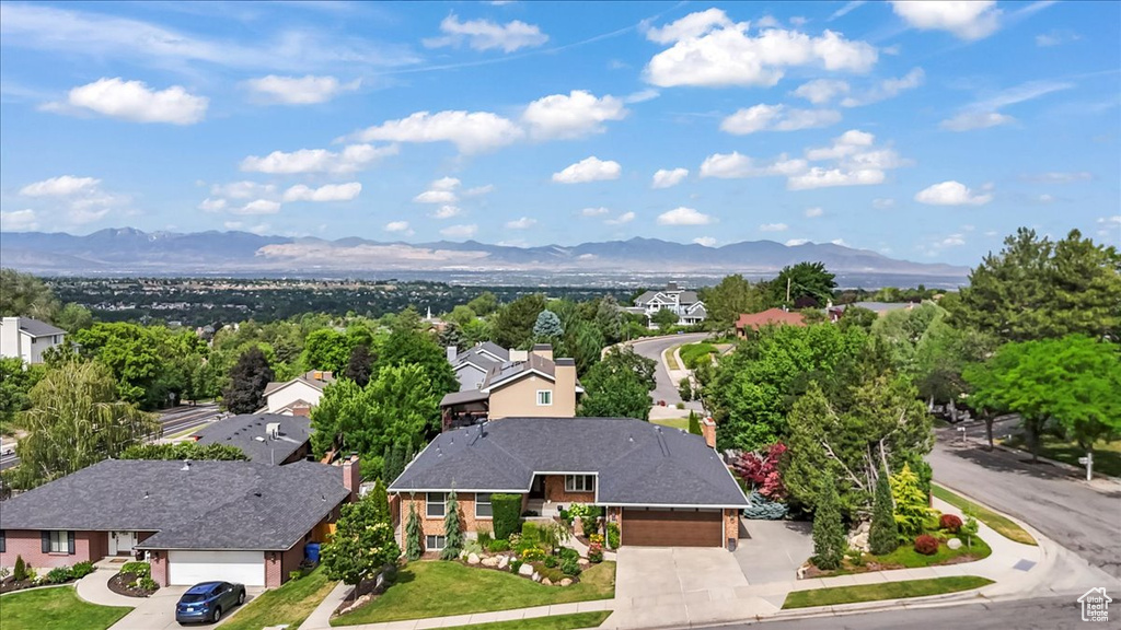 Aerial view of residential area featuring mountains
