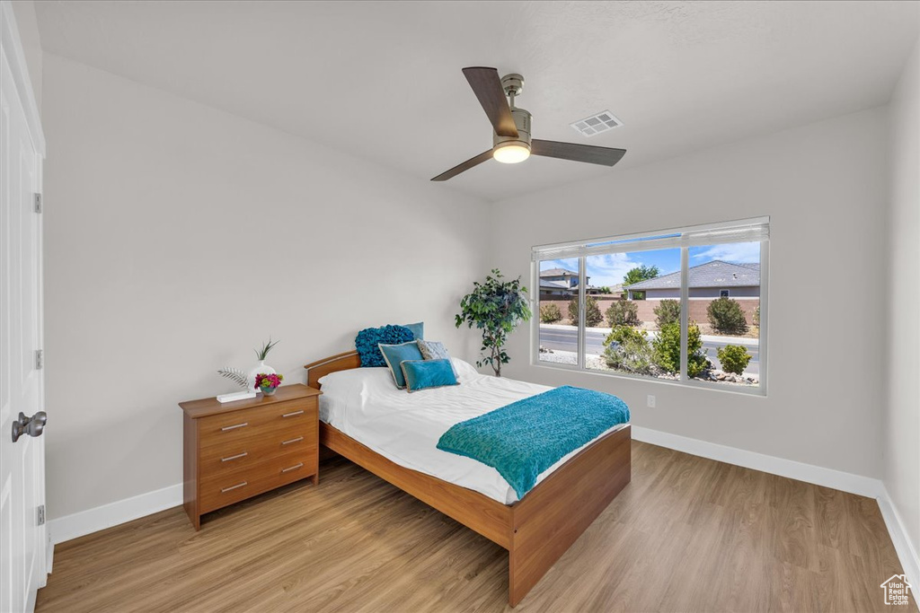 Bedroom featuring light wood finished floors and a ceiling fan