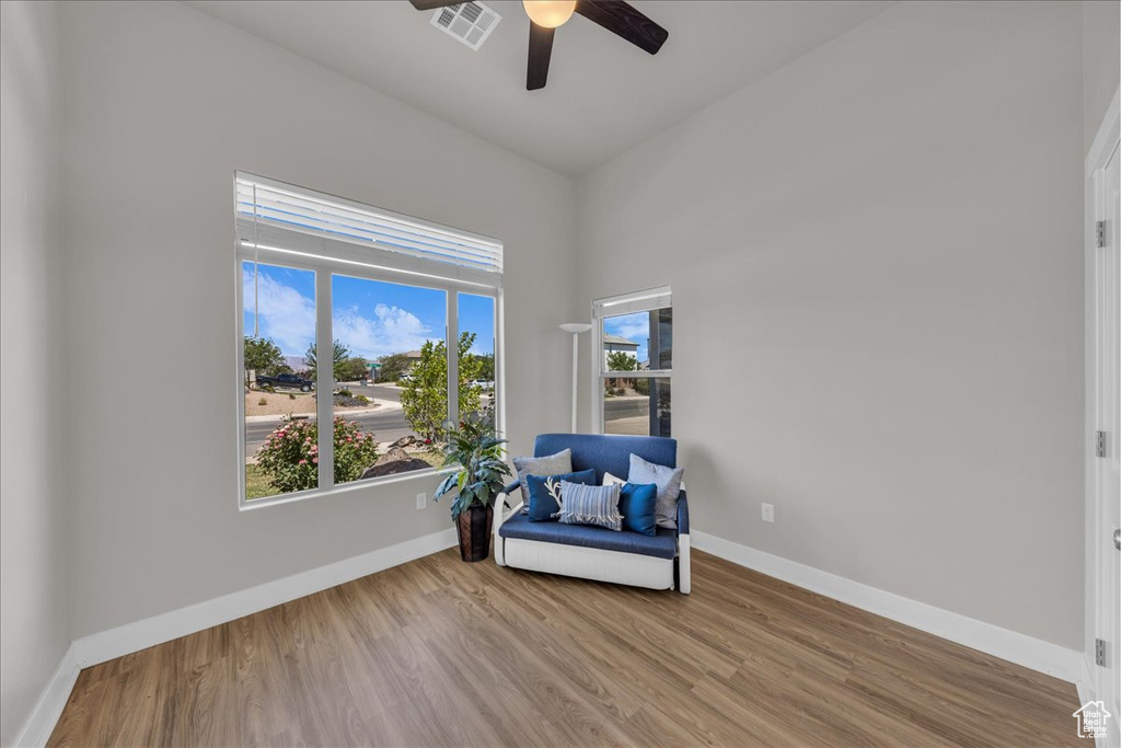 Unfurnished room featuring ceiling fan and wood finished floors