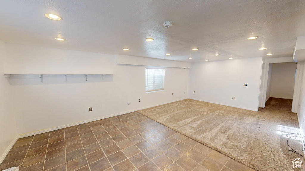 Basement with recessed lighting and carpet floors