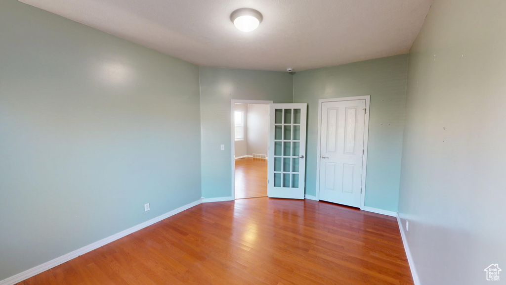 Empty room with wood finished floors