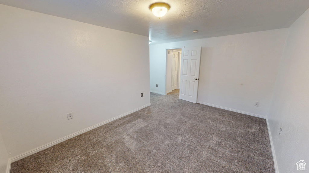 Spare room with carpet flooring and baseboards