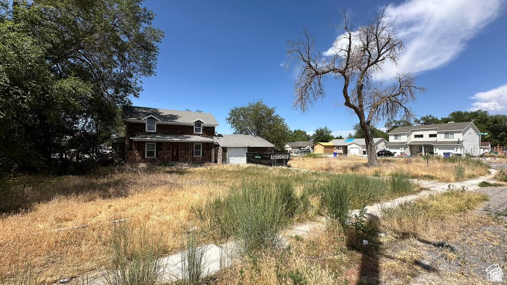 View of yard with an attached garage