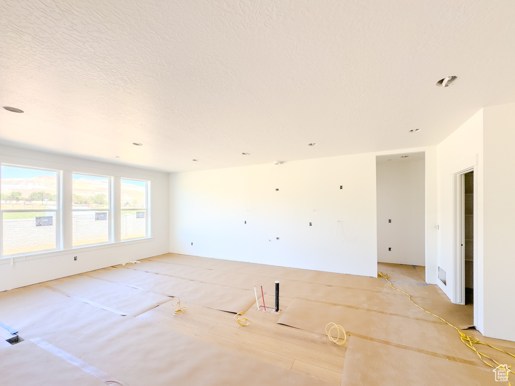 Spare room featuring a textured ceiling