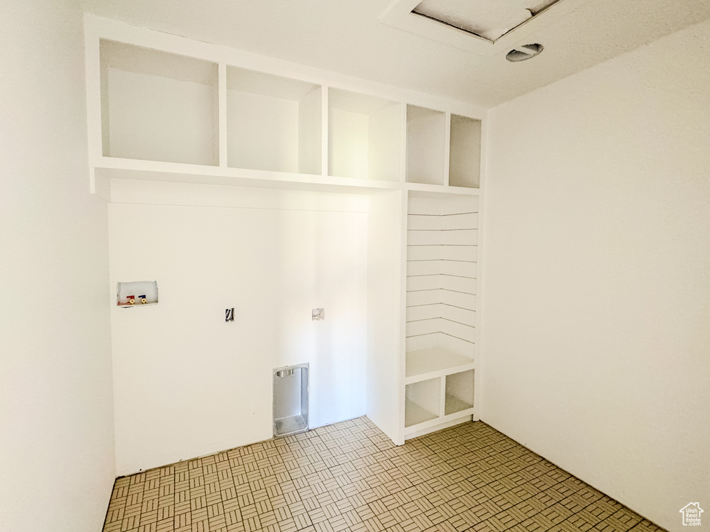 Washroom featuring hookup for a washing machine and attic access