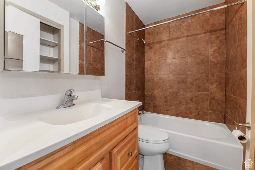 Bathroom with vanity and  shower combination