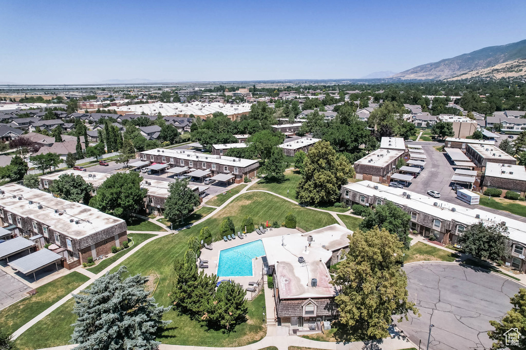 Aerial view of a pool area and a mountain backdrop