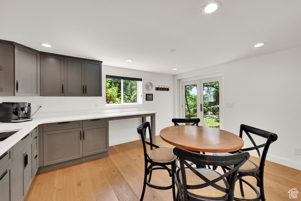 Dining area featuring plenty of natural light, recessed lighting, and light wood-style flooring
