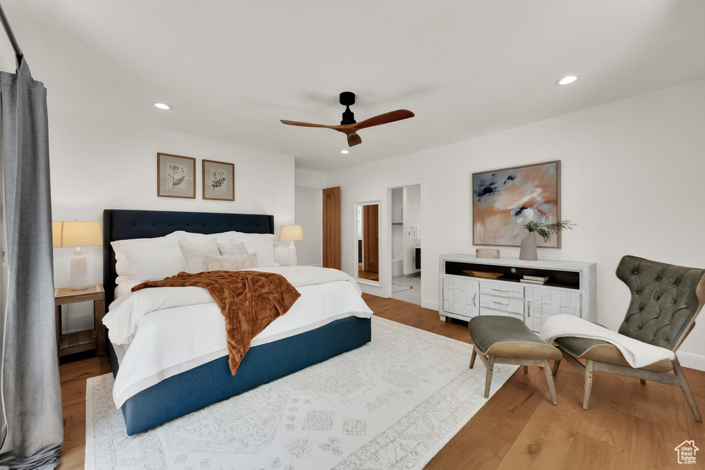 Bedroom featuring recessed lighting, wood finished floors, a ceiling fan, and connected bathroom