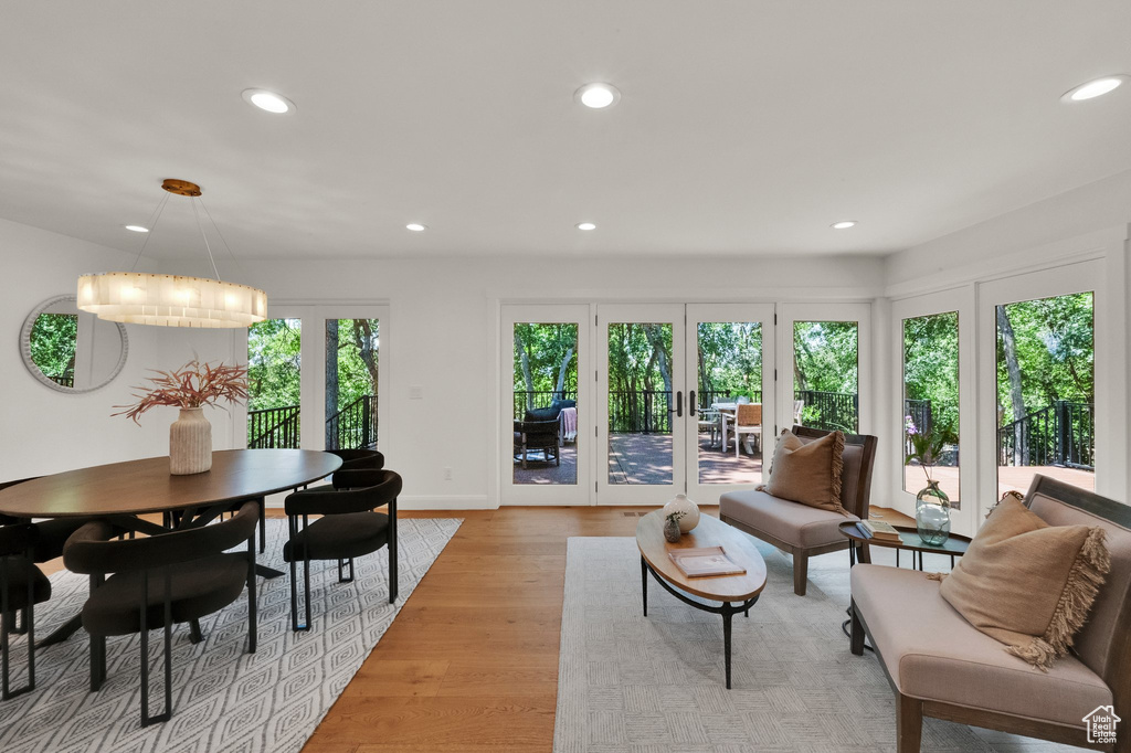 Living area with recessed lighting, light wood-type flooring, and french doors