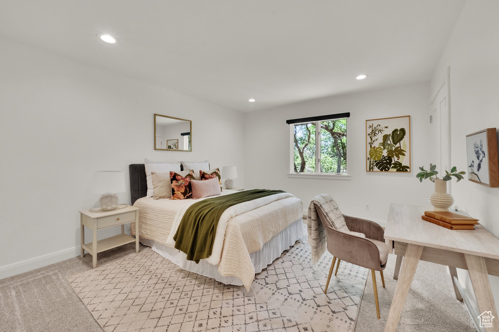 Bedroom with recessed lighting and light carpet