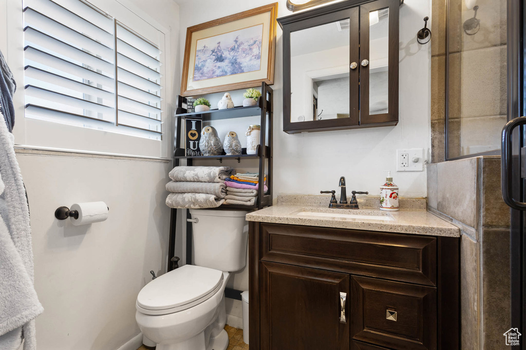 Bathroom featuring toilet and vanity