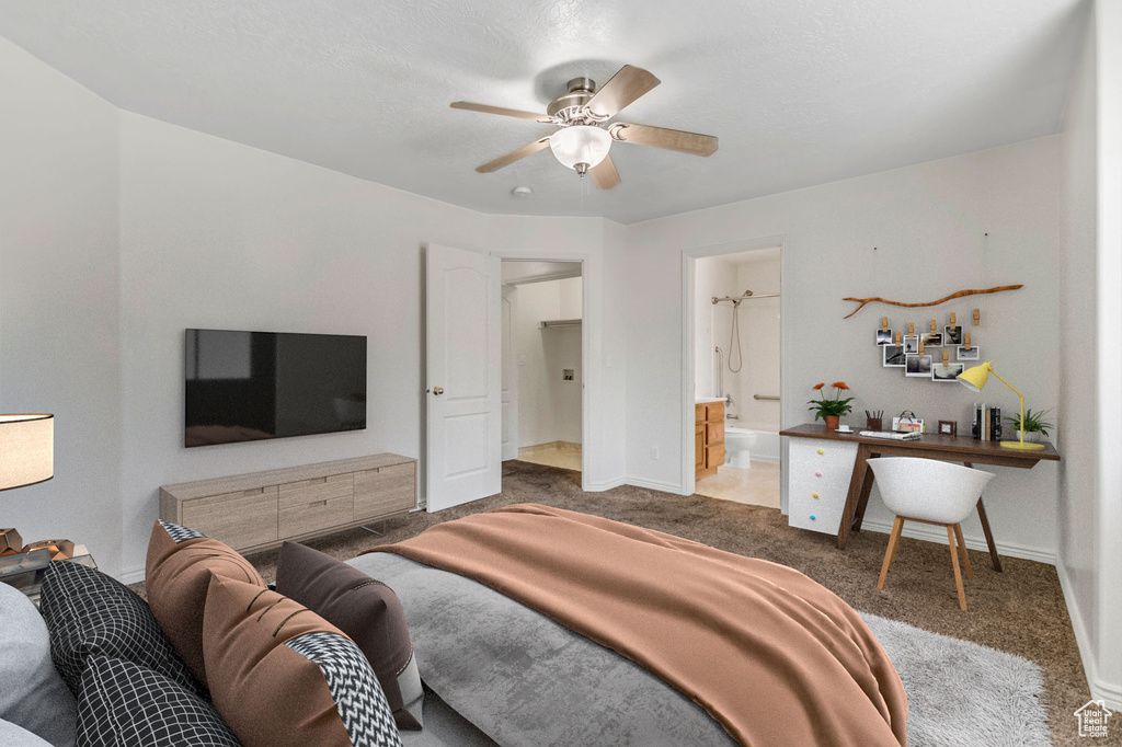 Bedroom featuring carpet flooring, ceiling fan, and connected bathroom