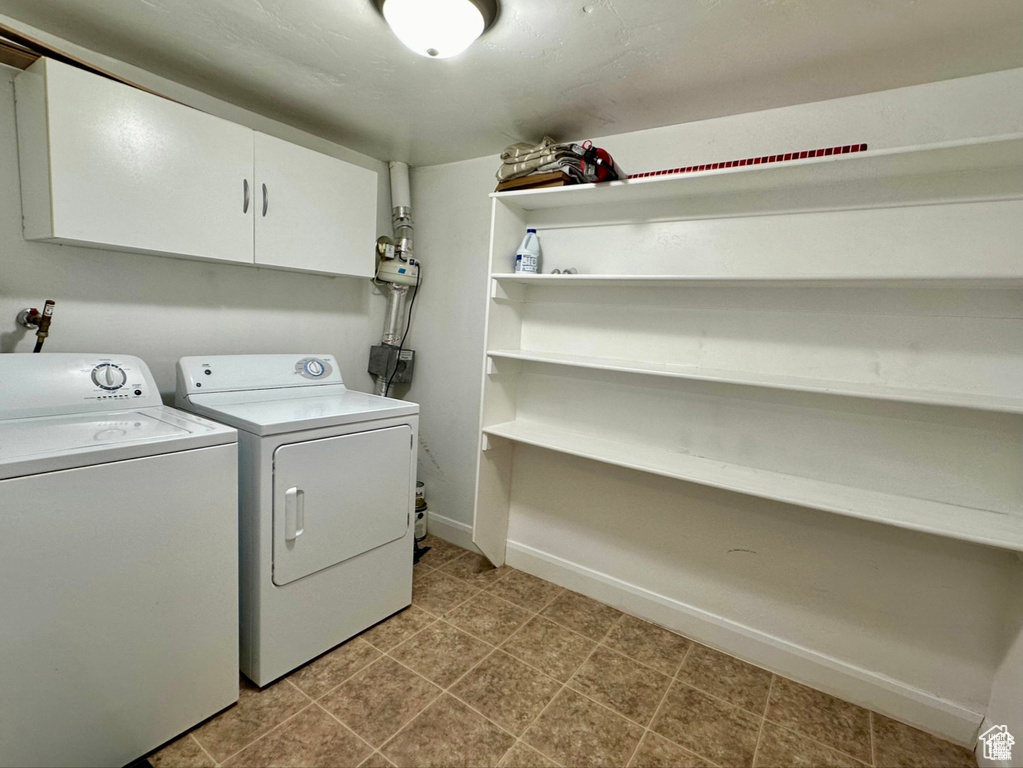 Laundry area with washing machine and dryer and cabinet space