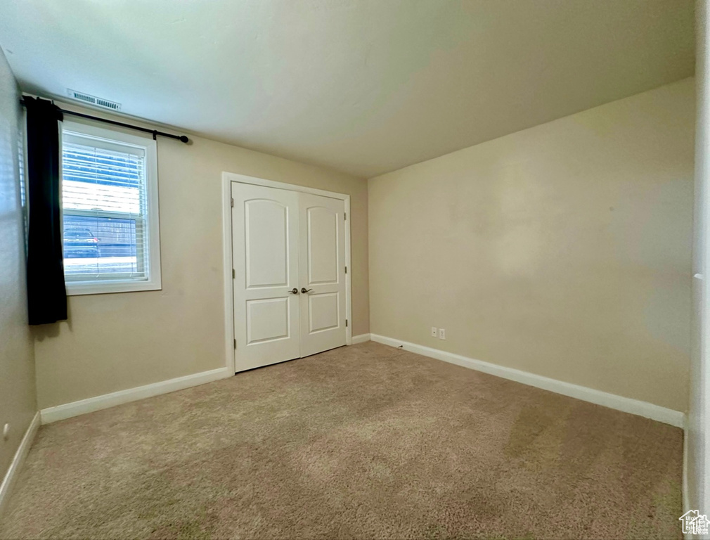 Unfurnished bedroom featuring carpet floors