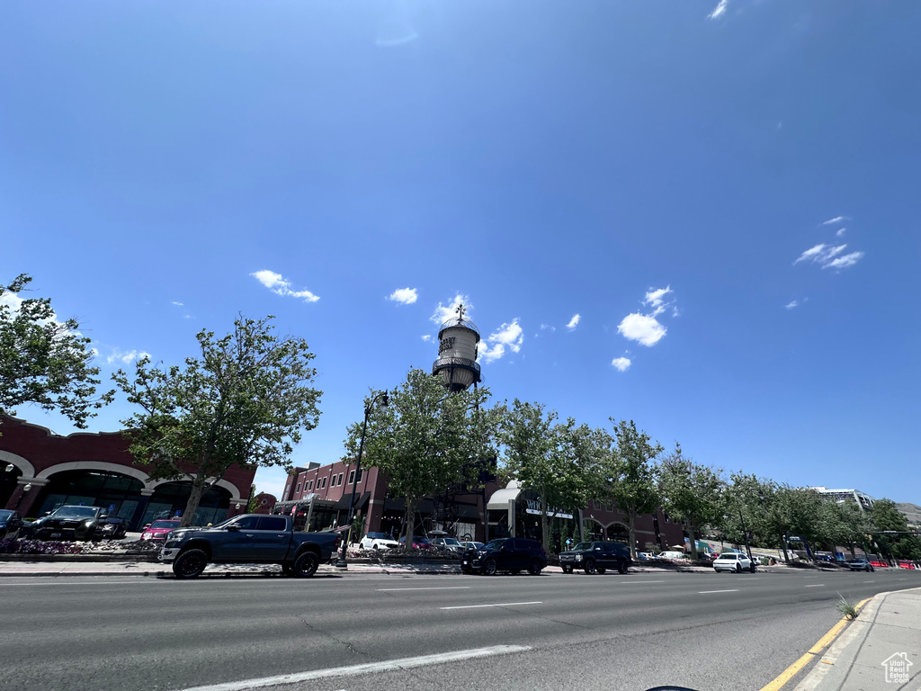 View of asphalt street with sidewalks and curbs