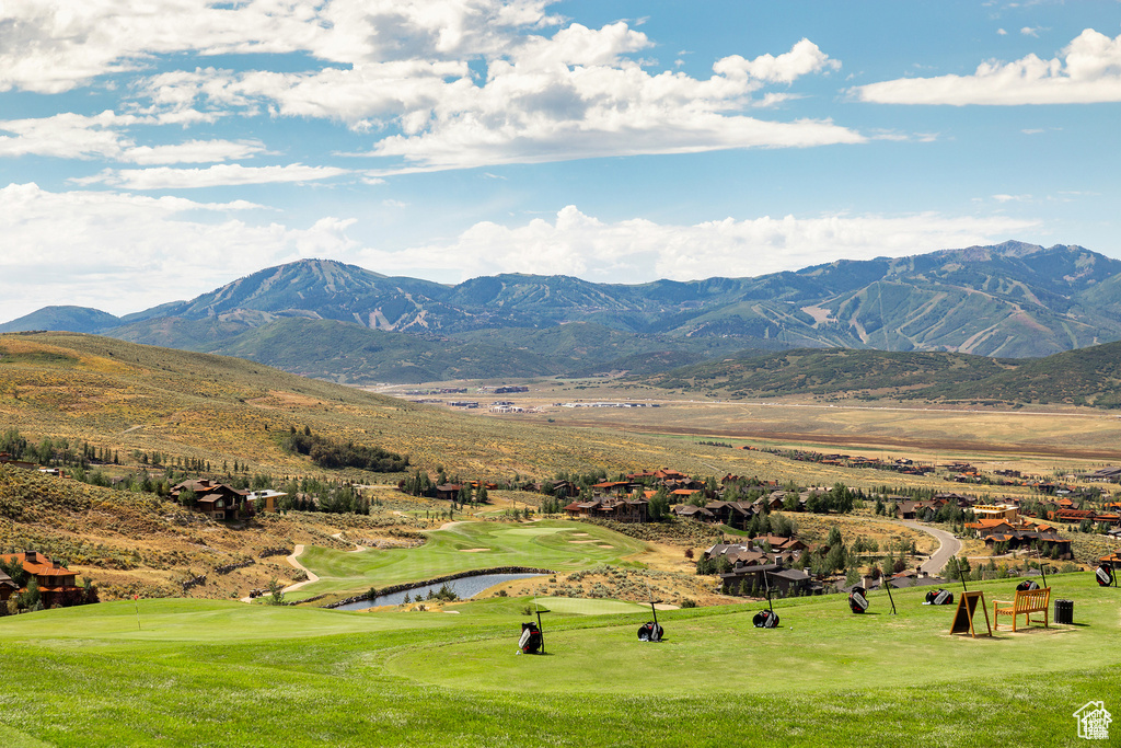 Mountain view with a golf club and a nearby body of water
