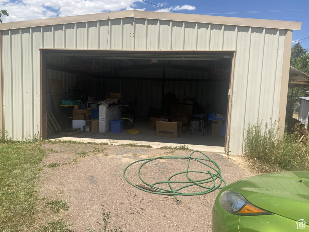 View of outbuilding with a garage